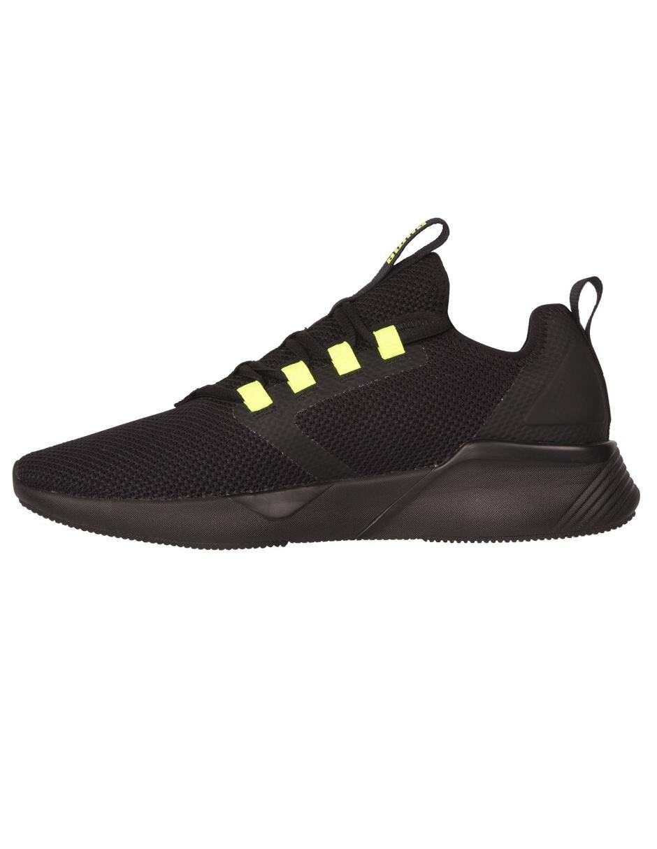 tenis puma negro con amarillo